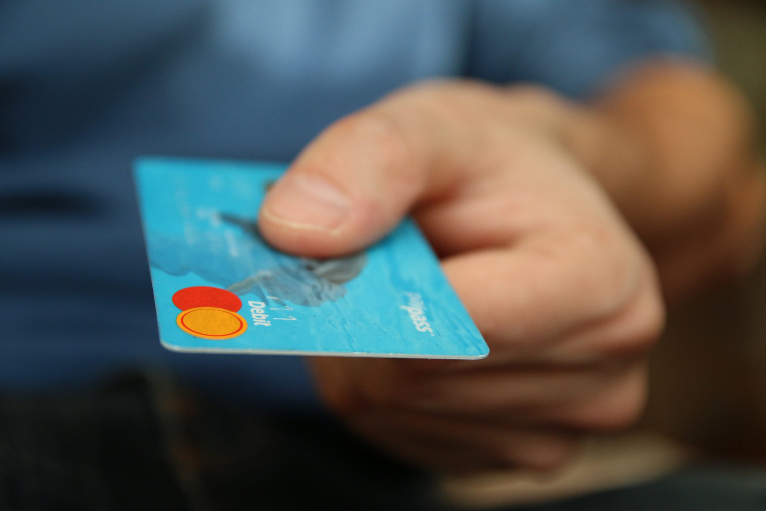 Blue mastercard being held